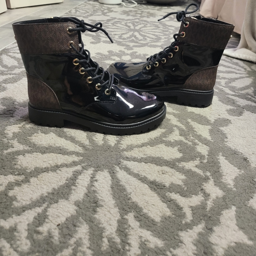 NWOT. Michael Kors patent leather rain boots with brown logo monogram detail.